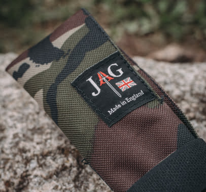 JAG self take slick sleeve in camo with logo, resting on a rock